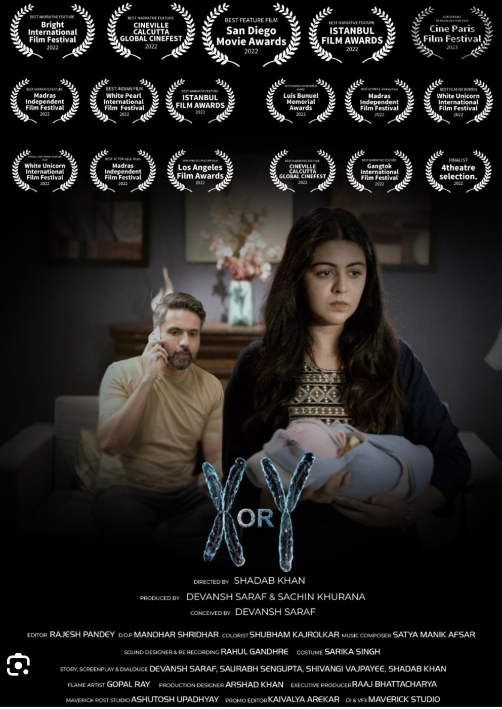 Poster for X or Y: a young mother holds a newborn while a man behind her talks on the phone; the title is set in chromosome shapes
